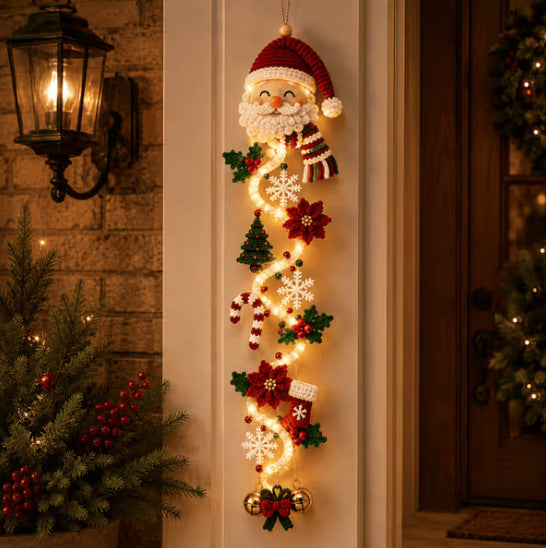 Velmerry Glowing Christmas Door Hanger, Santa Claus character, illuminated at a front door